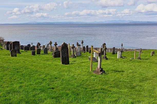 istock A graveyard sits on a green hill overlooking the sea. 2220005864