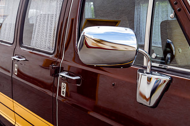 istock Side view mirror and doors of vintage brown van with chrome details 2220006628