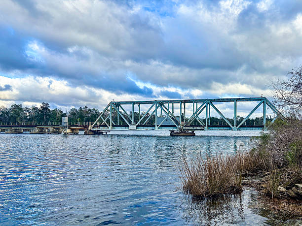istock Historic Blackwater River Railway Swing Bridge in Milton, Florida under Dramatic Sky 2220008876