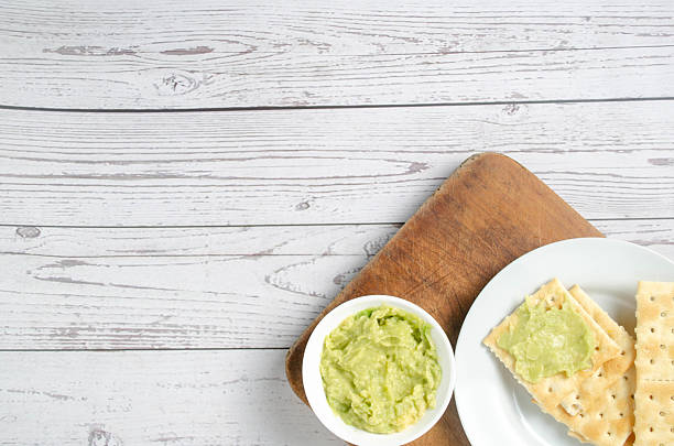 The texture of avocado paste or guacamole sauce is soft and thick