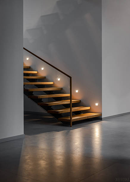 istock Wooden staircase with handrails in loft interior. 2220017112