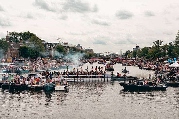 Amsterdam, North Holland, Netherlands, Europe - August 3, 2024: Canal gay parade in the city, LGBTQIA+ pride at the street near the Amstel river