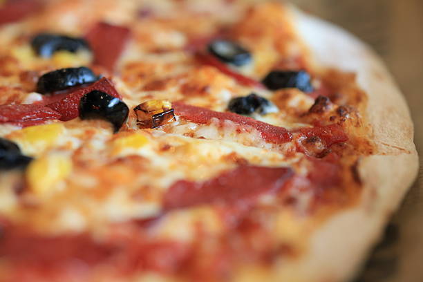 italian pizza in oven on rotating platform