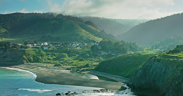 Drone shot of Pacific waves crashing against the rugged and rocky coastline of Mendocino County, California near the small town of Elk.