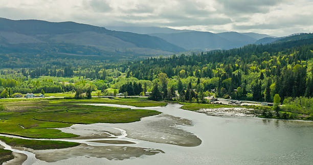 Aerial shot of the landscape in the foothills of the Olympic Mountains around the tidal estuary of Discovery Bay, on the Olympic Peninsula in Jefferson County in Washington State.
