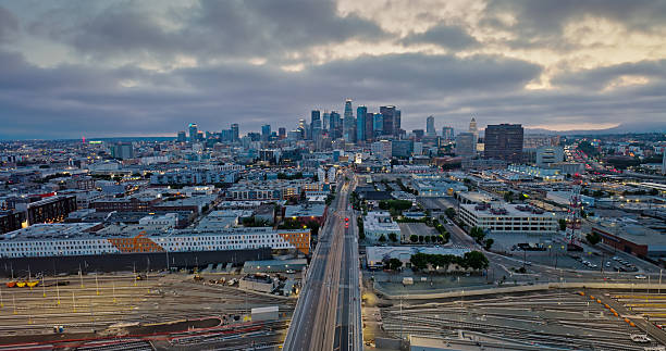 istock Heavy Cargo Railways Below Downtown Los Angeles in a Wide Angle Drone Shot Looking West 2220023085