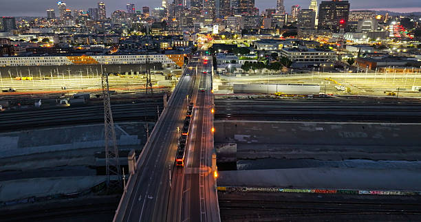 istock Wide Angle Drone Shot Looking Down on a Los Angeles Metro Train Headed Into Downtown 2220023086