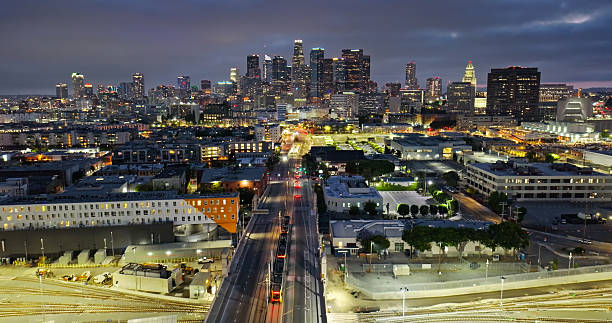 istock Wide Angle Drone Shot Looking Down on a Los Angeles Metro Train Headed Into Downtown at Night 2220023091