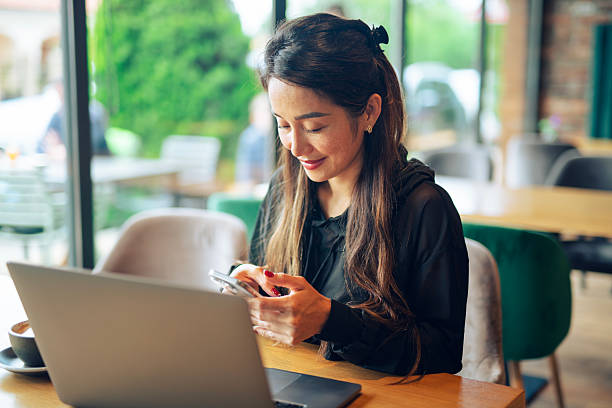 istock Businesswoman working and having a coffee at a cafe. 2220025403