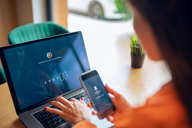istock Asian woman logging in her account with a security password. 2220025414
