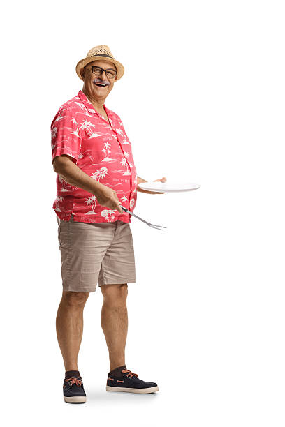 istock Mature man holding a fork and a plate 2220033449
