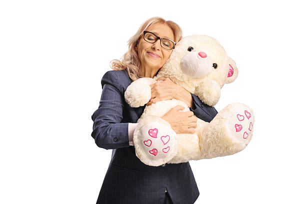 istock Happy mature woman hugging a teddy bear 2220033953