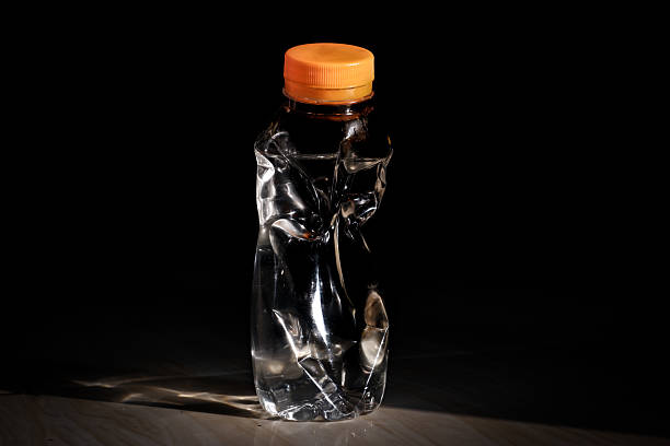 istock Crushed Plastic Bottles for Recycling on Black Background, plastic bottle waste 2220040437