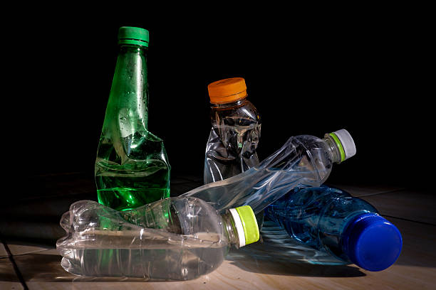 istock Crushed Plastic Bottles for Recycling on Black Background, plastic bottle waste 2220040445