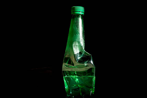 Crushed Plastic Bottles for Recycling on Black Background, plastic bottle waste