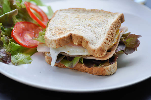 istock ham and cheese sandwich or egg sandwich with salad 2220041699