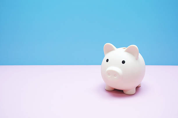 istock Piggy banks saving with space copy on pink background 2220045510