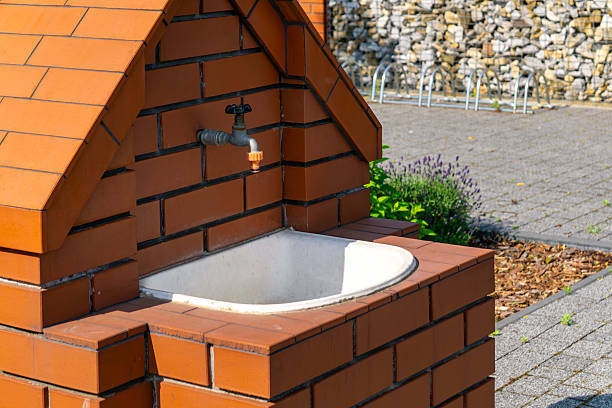Outdoor brick sink with faucet and ceramic basin
