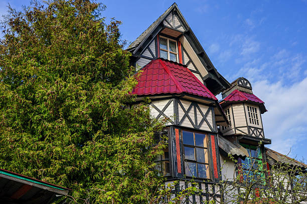 New Orleans, Louisiana in Mardi Gras Carnival Celebrations. Traditional colorful houses with ornate balconies and dormers in the historic French Quarter of New Orleans, Louisiana, a popular travel destination for Mardi Gras and other festivals