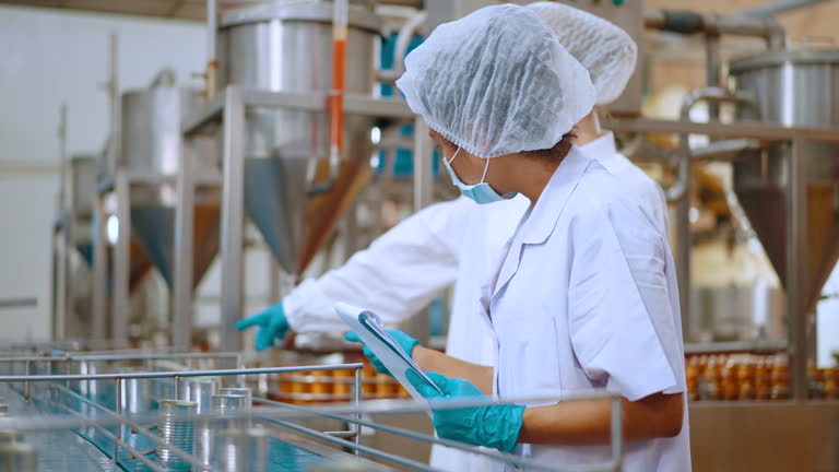 Team reviewing production efficiency on food processing plant.