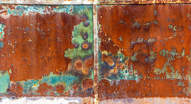 istock Rusty metal with peeling green paint leftovers 2220066502