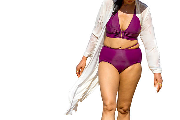 istock Woman in purple bikini isolated 2220066778