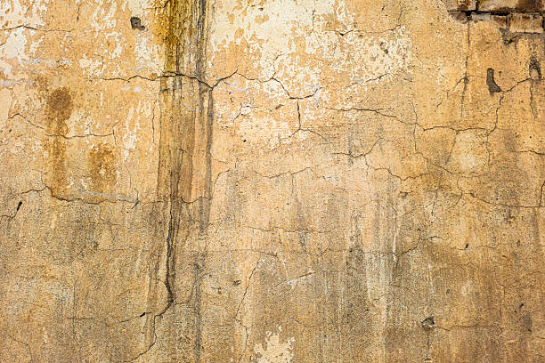 istock Aged beige stucco wall texture, weathered surface, grunge background, cracked plaster, distressed finish, textured, nobody, no people 2220068044