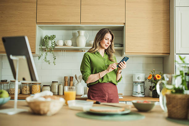 istock Woman doing a first morning tasks in the kitchen 2220068177