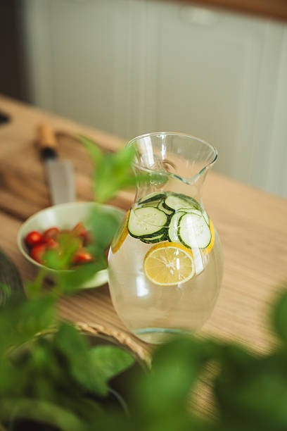 Lemonade with cucumber on kitchen counter