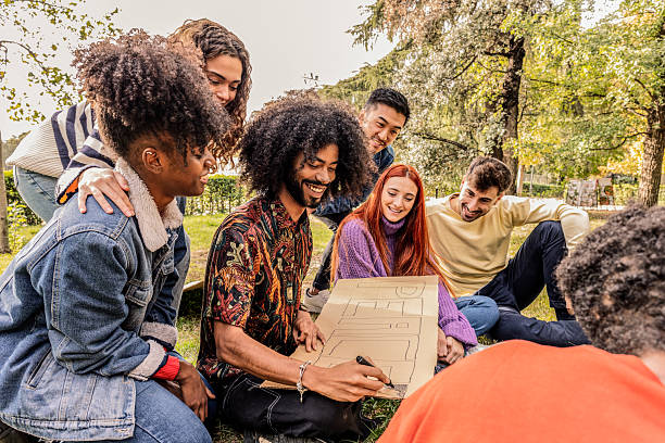 istock Group of young activists preparing protest banner in park 2220072908