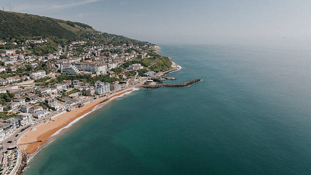 istock A beautiful beach with a city in the background 2220076433