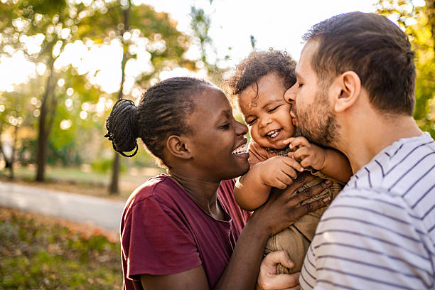 istock Happy multiethnic family is having fun in the park 2220079005