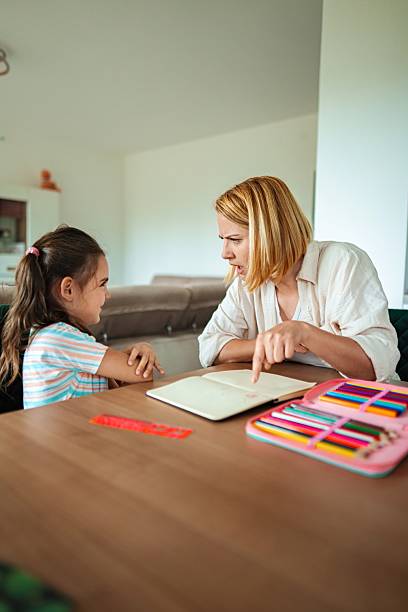 istock Mother helping her daughter with homework and getting angry 2220079549