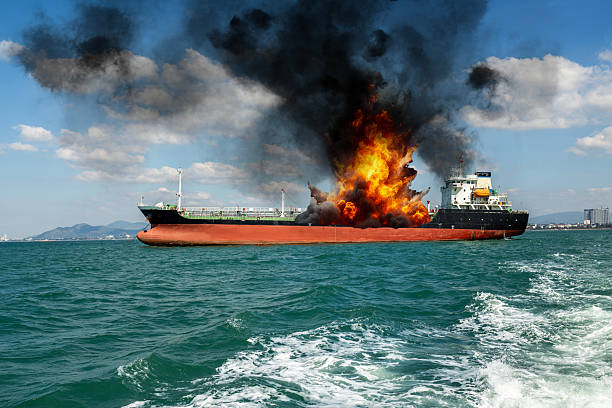 istock Fire on a cargo ship. A ship carrying liquefied gas is engulfed in flames. Explosion and fire on a gas carrier on the high seas. 2220080850