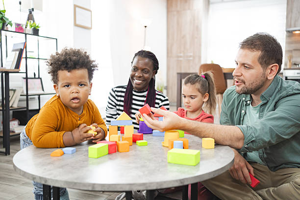 istock Family playing with building blocks at home 2220081224
