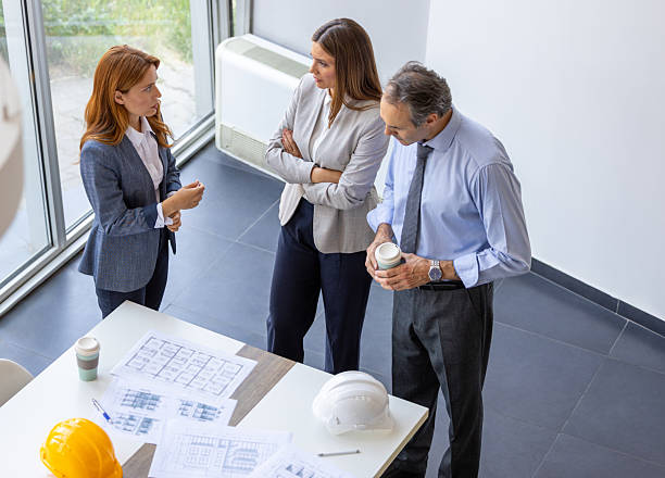 istock Architects discussing building plans in the office 2220082909