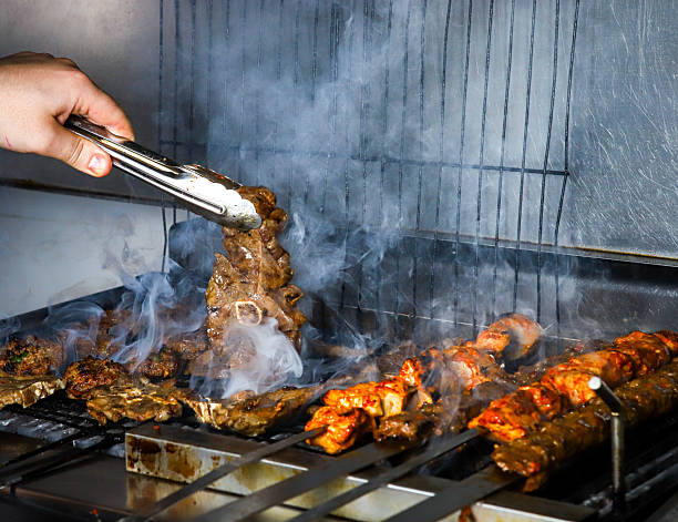 istock Aromatic Kebabs Cooking Over Charcoal on a Grill (Mangal) 2220089217