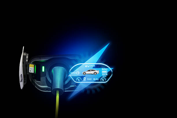 istock Power cable pump plug in charging power to electric vehicle EV car. 2220089397