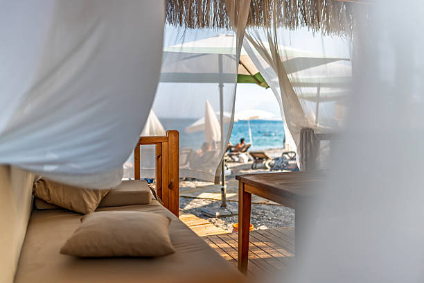 istock Luxury Wooden Beach Cabana with Sheer Curtains and Ocean View 2220090528