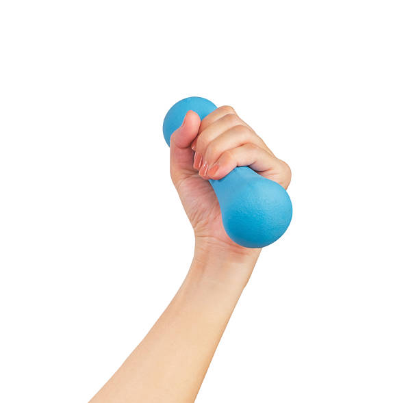 istock Female hands holding blue dumbbell isolated on white background, clipping path. 2220090579