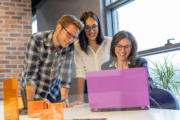 istock Young Couple Consulting with Female Professional in Modern Office Setting 2220093122