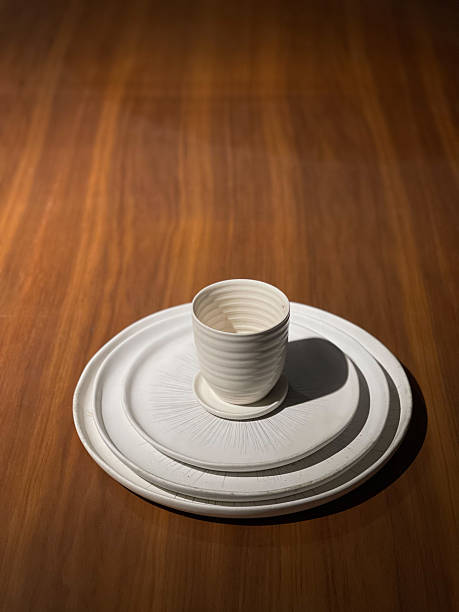 A cup on top of a few different size plates