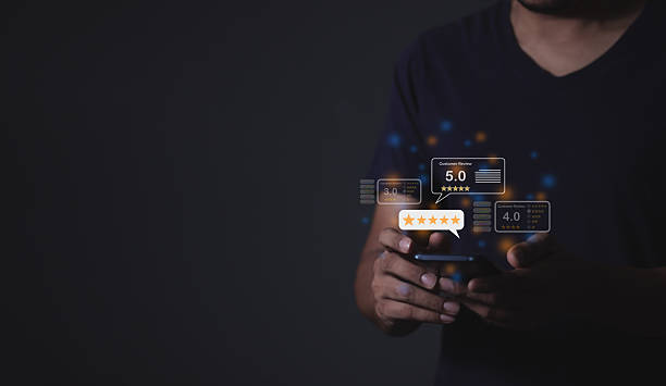 istock Customer Review, Young Man hand using smartphone mobile with five star to review and give 5 stars with very good results in service, Good review 5 star rating choice feedback 2220101456