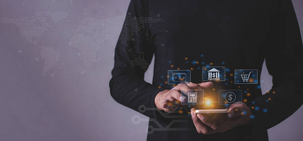 istock Young man with smartphone mobile hand touching to visualize money growth The phone screen displays graphs and charts showing increasing investment and savings trends, along with an increased account balance 2220101468