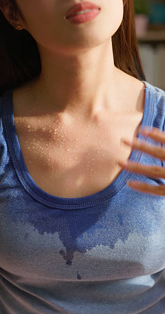 istock woman sweating summer discomfort 2220102037