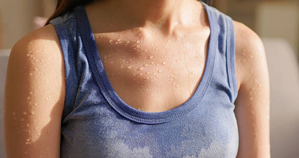 istock woman sweating summer discomfort 2220102081