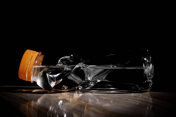 Crushed Plastic Bottles for Recycling on Black Background, plastic bottle waste