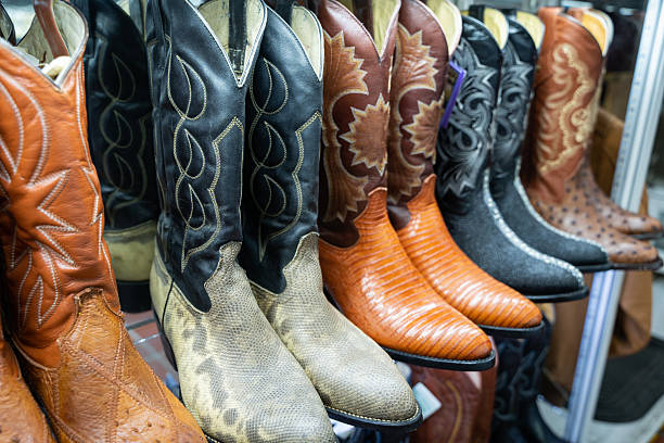 istock Handcrafted Mexican cowboy boots in market stall 2220109091
