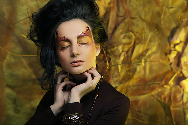 istock Beautiful brunette woman with bright creative make up 2220109321