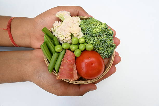 Vibrant medley of fresh vegetables.  Features broccoli, cauliflower, tomatoes, Carrot, green beans, and peas. colourful vegetables of spring time, Its good for health. colorful display.